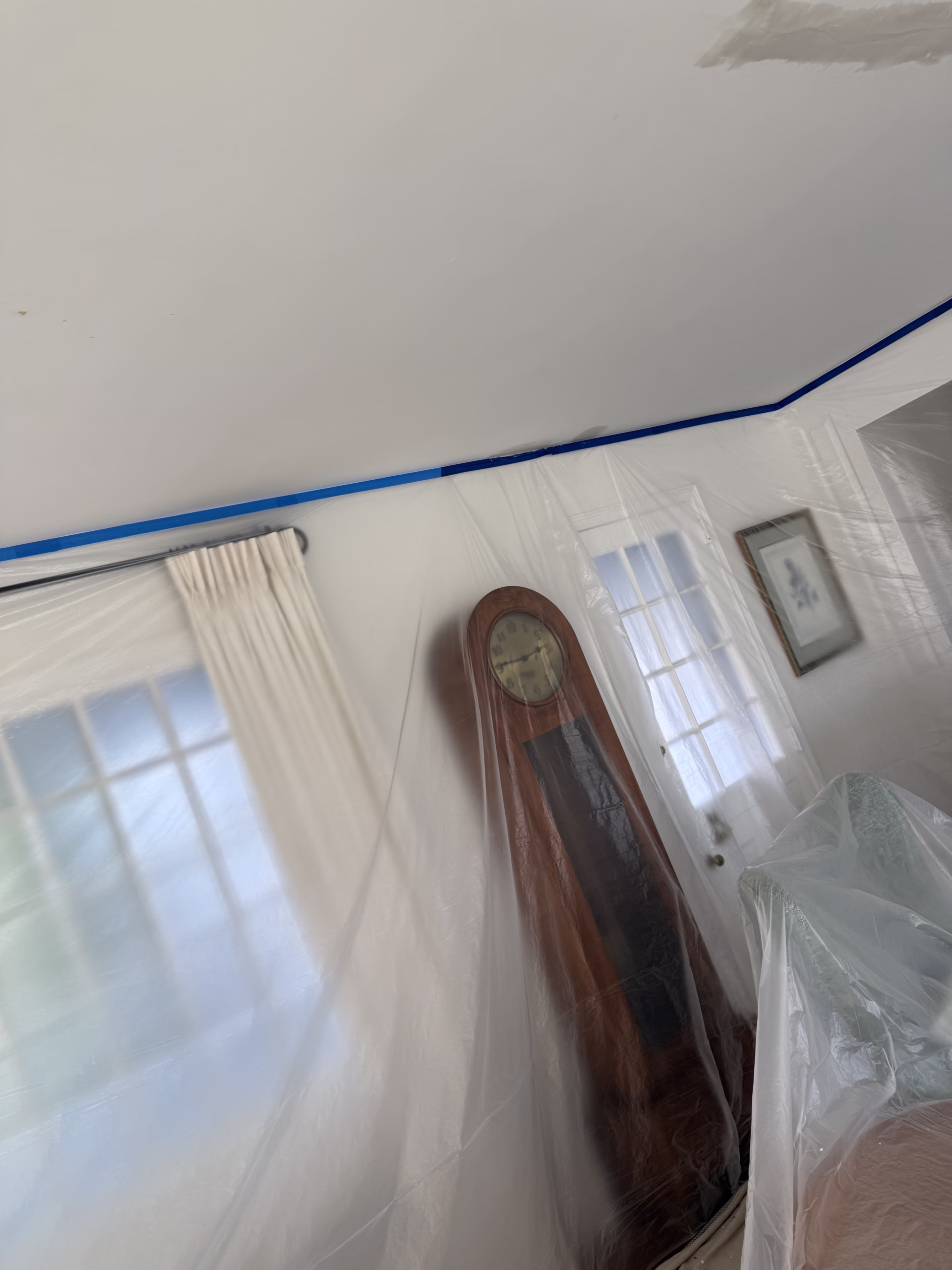 Room protected with plastic during drywall ceiling repair and painting in Ridgefield CT
