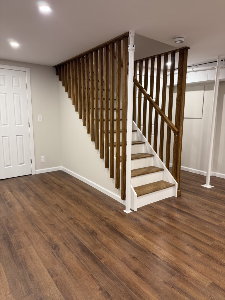 Finished basement painting and stained wood staircase in Easton CT