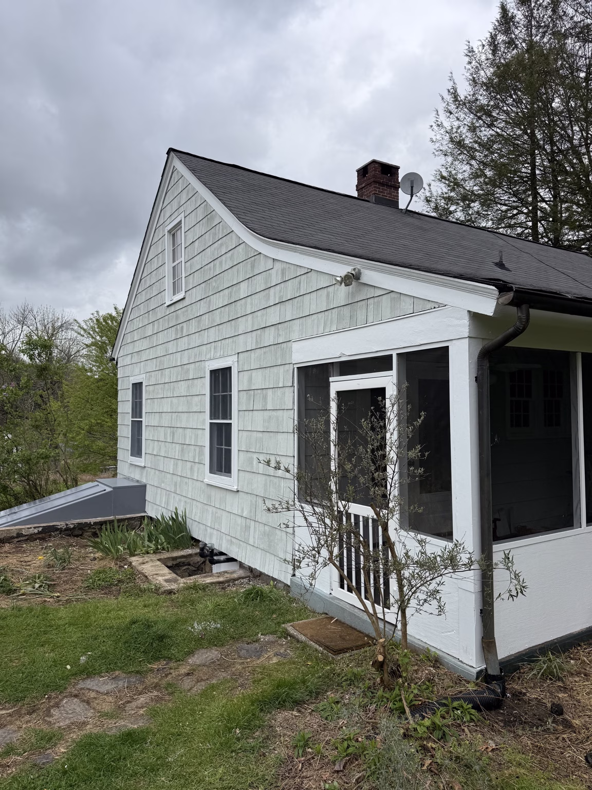Side view of home in Katonah, NY after exterior painting with Benjamin Moore solid stain