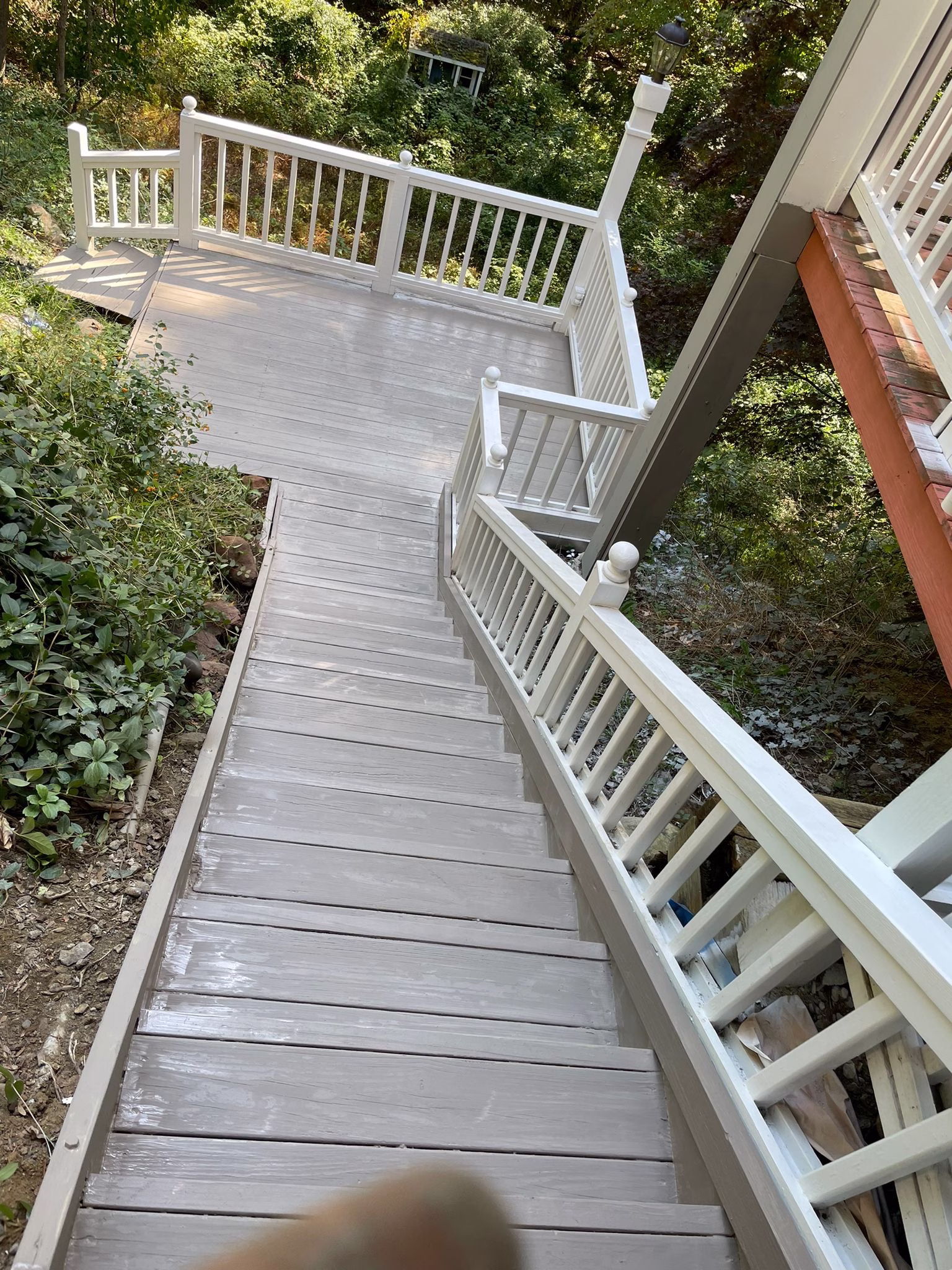 Refinished deck and stairs in Weston, CT after extensive preparation, primer and painting