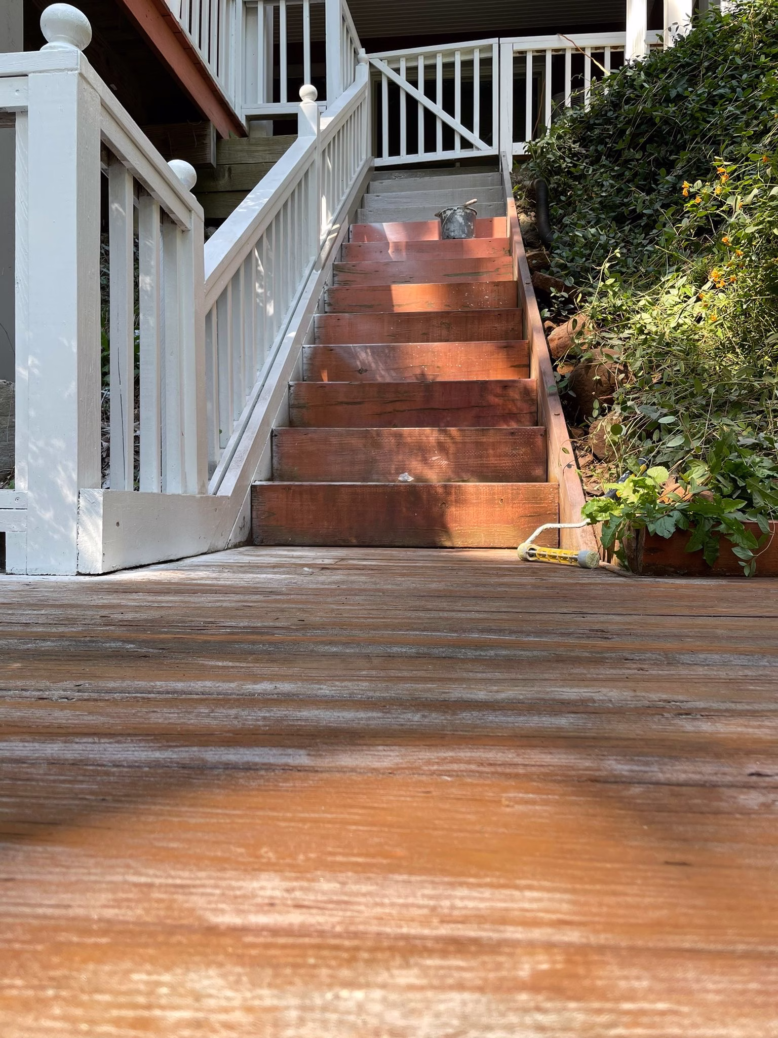 Old weathered deck and stairs in Weston, CT before refinishing, primer and painting