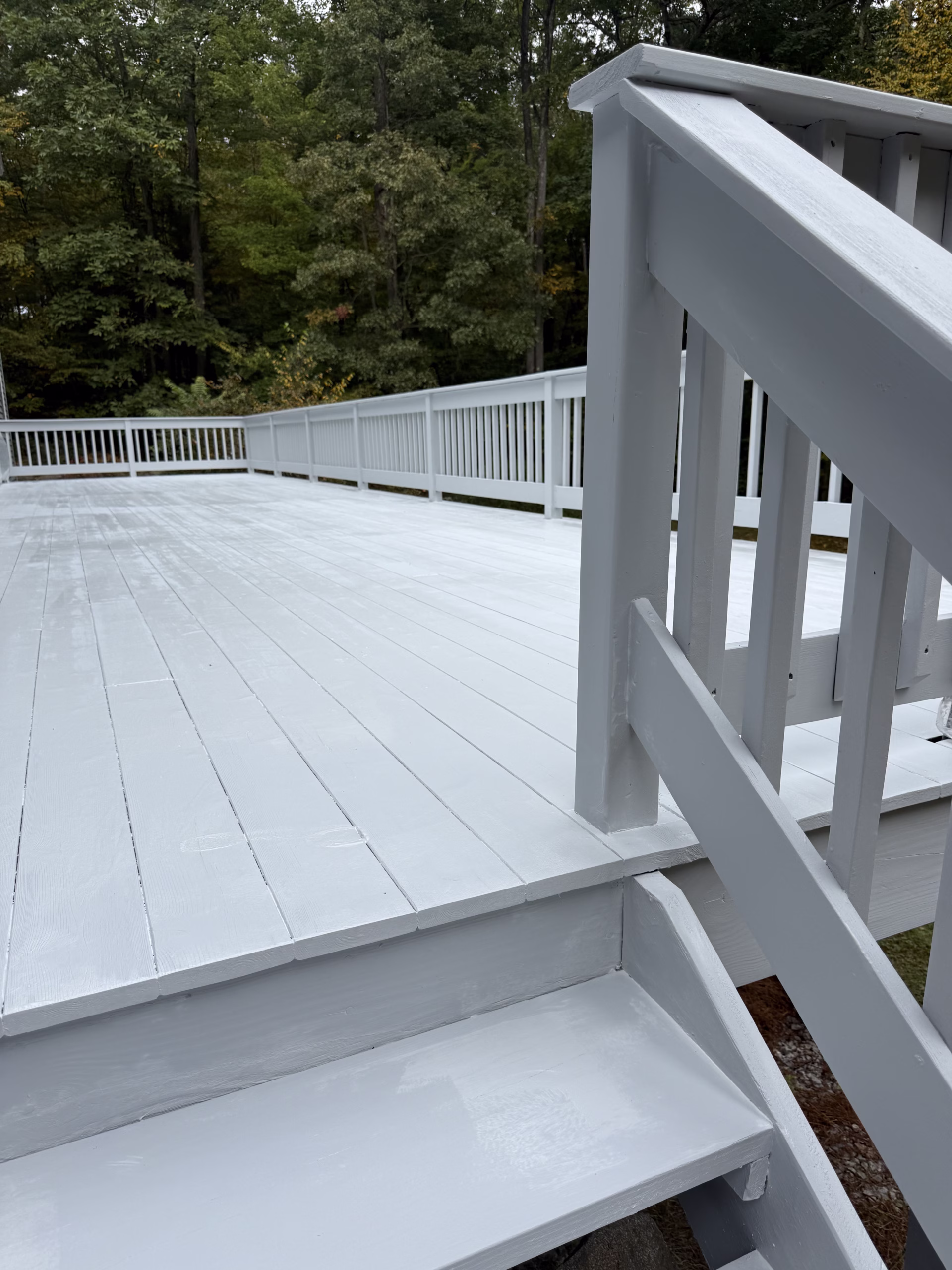 Finished deck renovation in Redding CT with Benjamin Moore Gray Lite solid stain