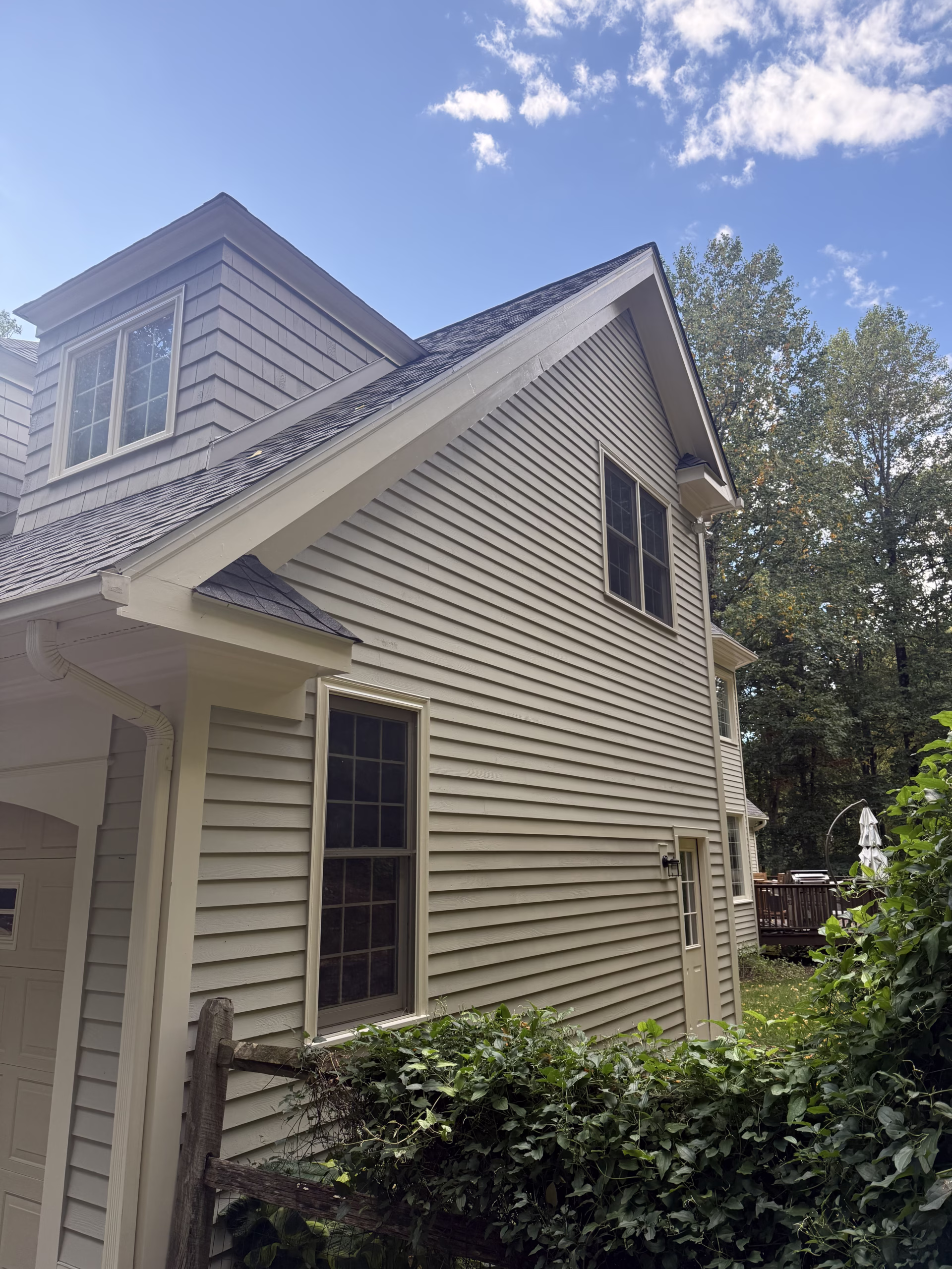 Exterior trim painting on Newtown CT home with Benjamin Moore Soft Gloss