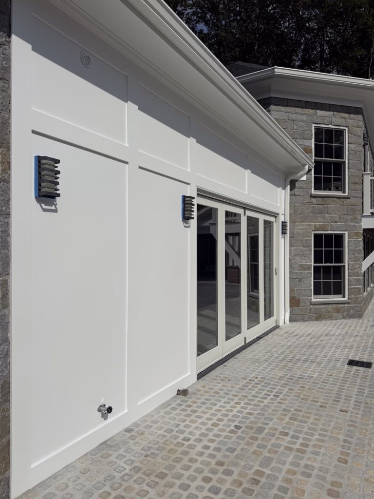 Exterior painting in Middlebury CT with white soft gloss ceiling panels and trim