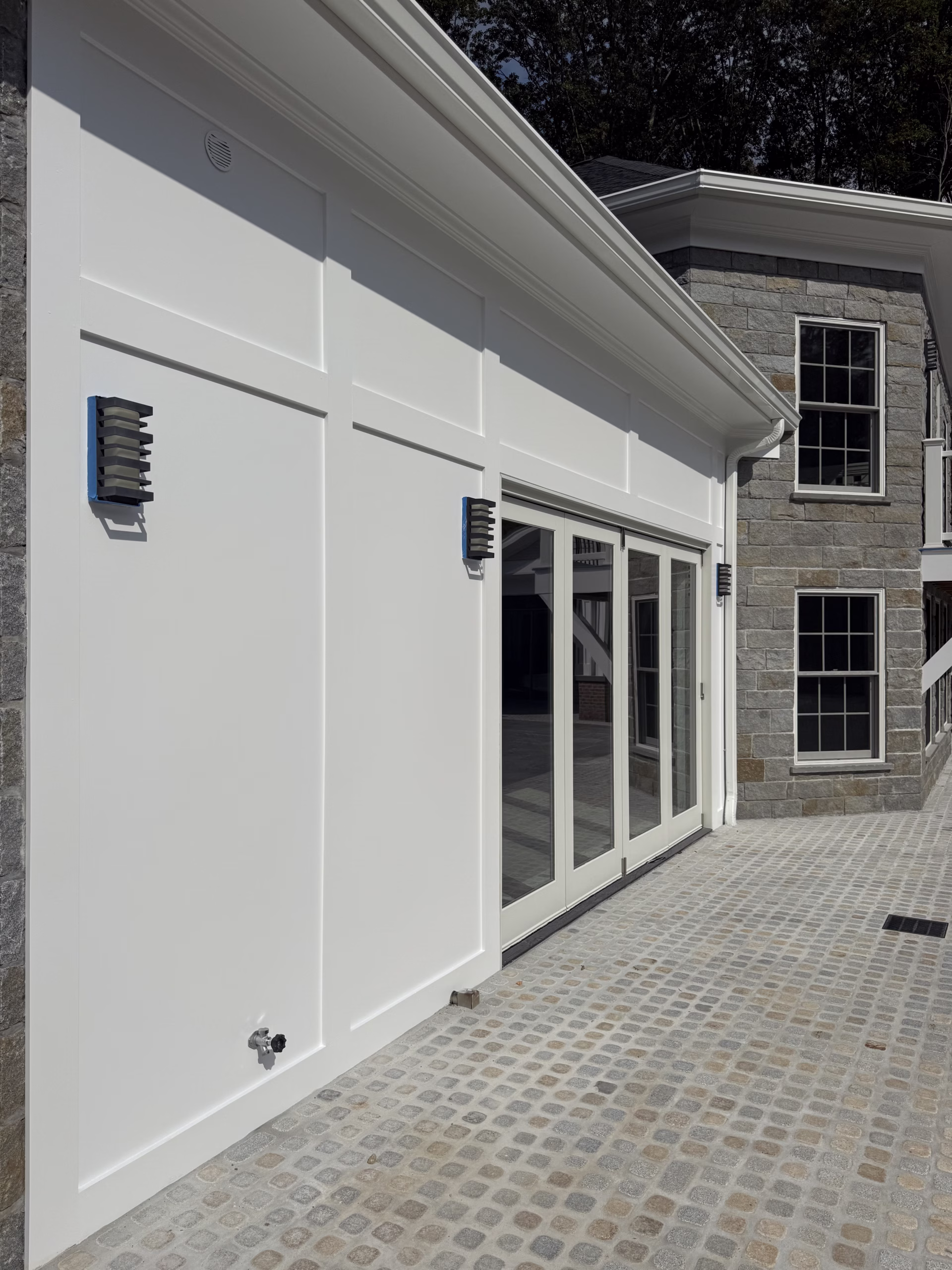 Exterior painting in Middlebury CT with white soft gloss ceiling panels and trim