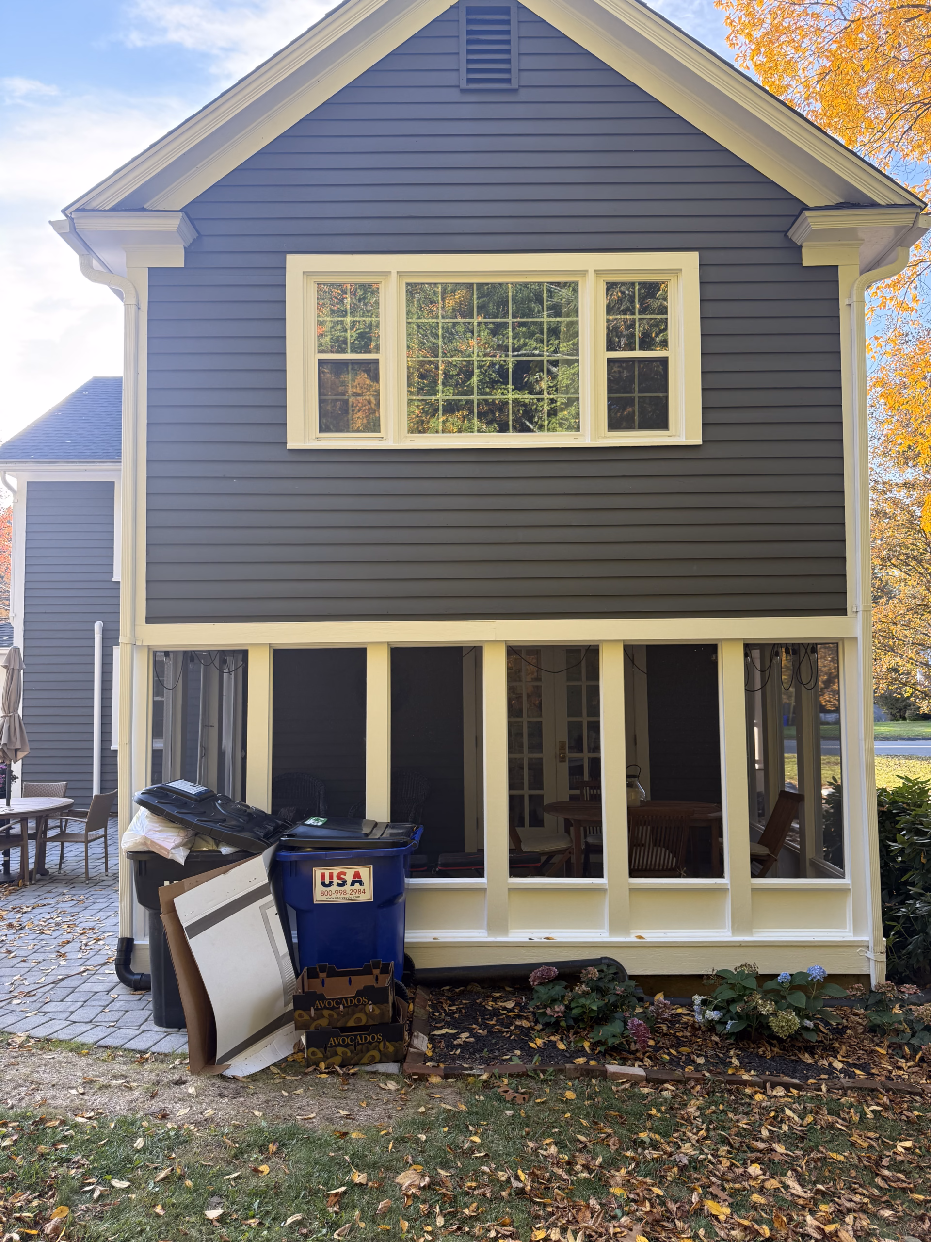 Light painted window trim and exterior details on a gray Colonial home in Simsbury CT.