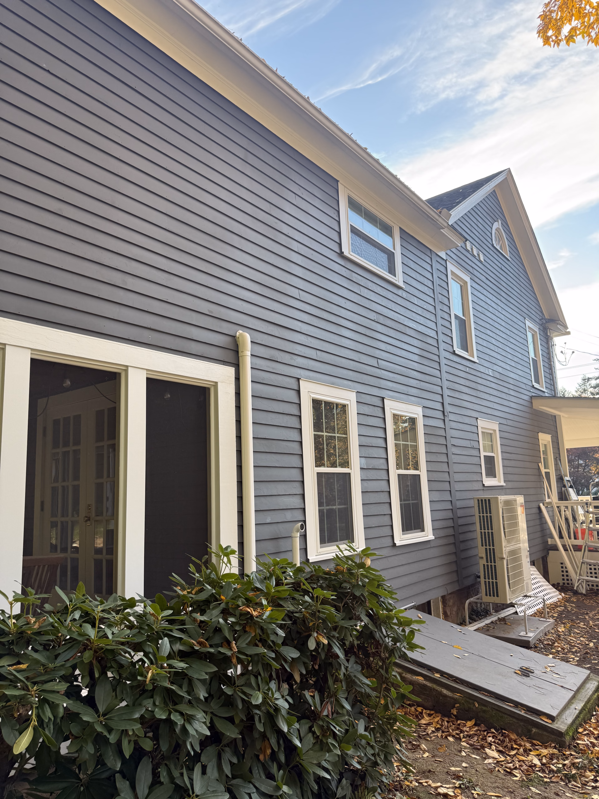 Painted exterior window trim along the rear elevation of a Colonial home in Simsbury CT.